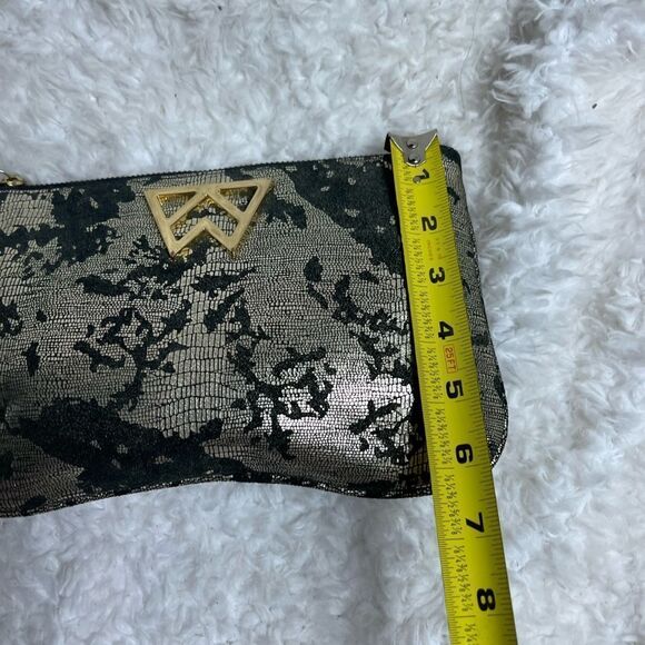 Kelly Wynne metallic gold and black wristlet with a gold tone logo accent - Picture 6 of 8